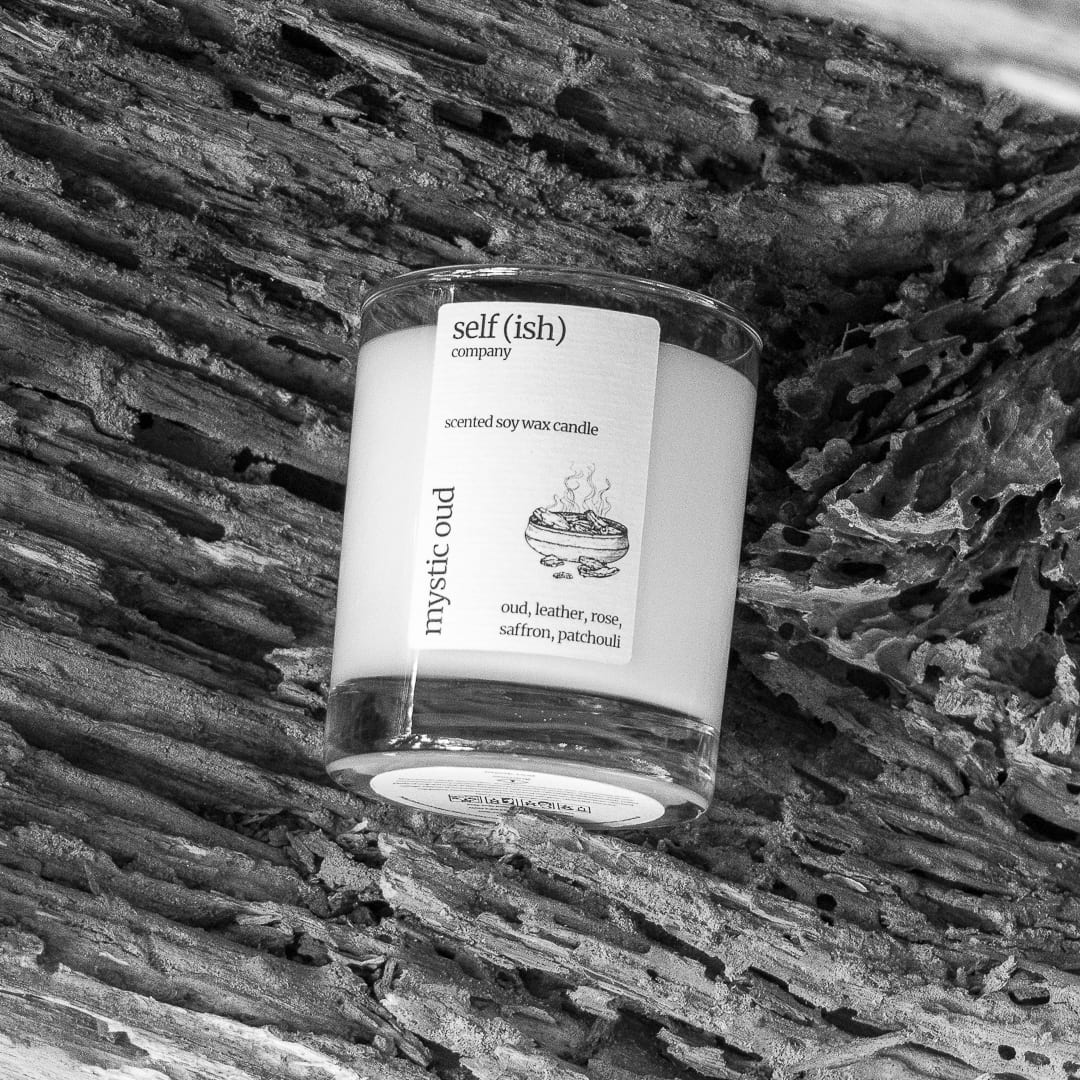 black and white photo of a scented candle with a historical look