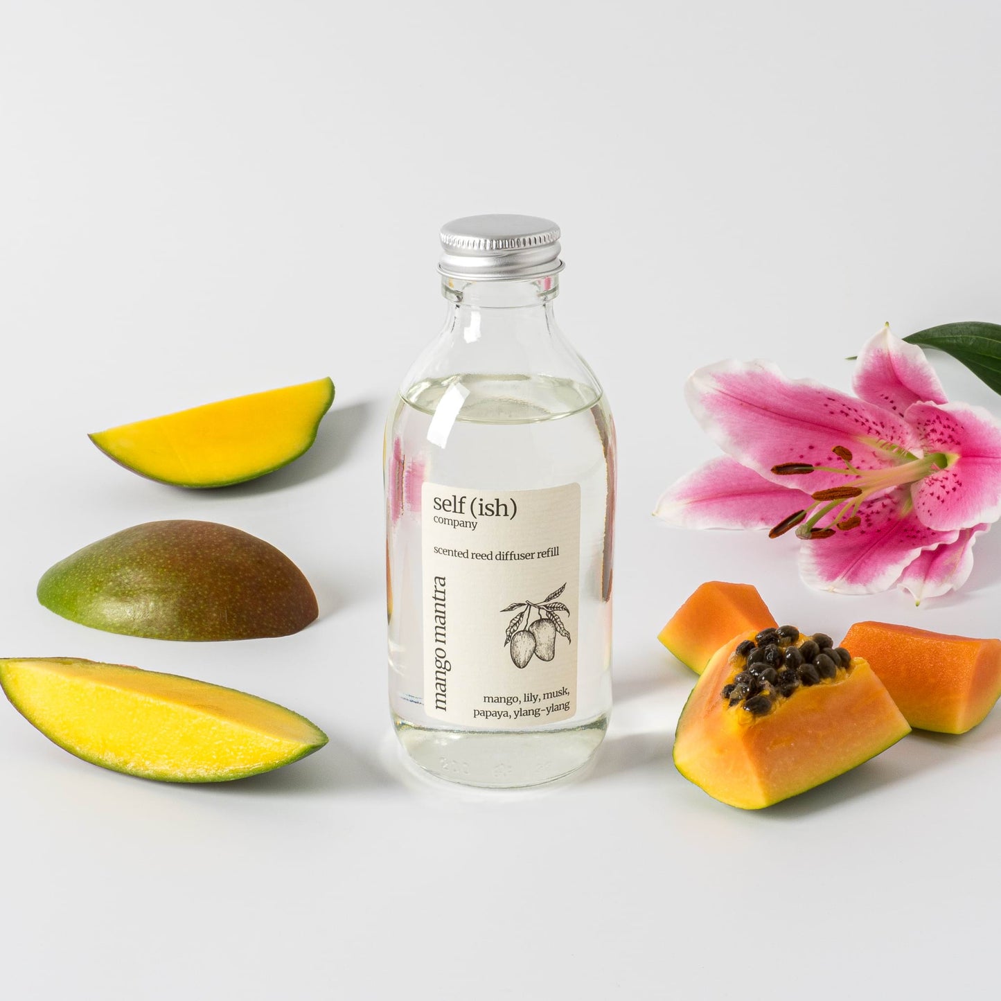 200ml mango reed diffuser refill surrounded by fresh fruits