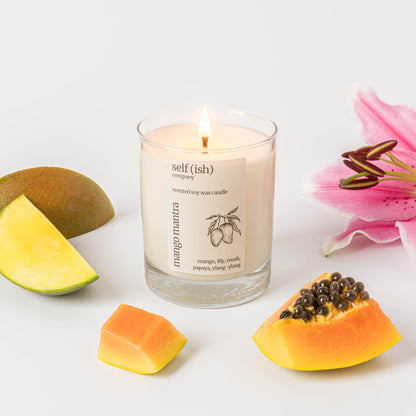 mango scented soy wax candle with a burning single wick and pretty label, eco-friendly candle for sale suitable for vegans, best candle to buy online in the UK, handcrafted candle