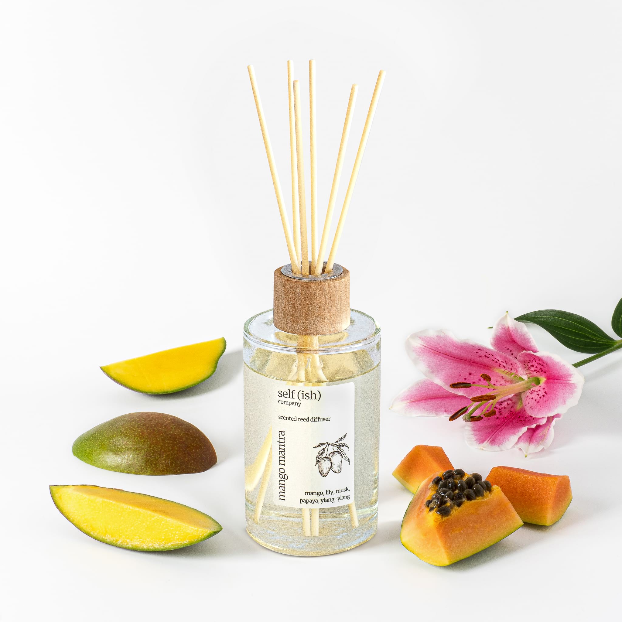 mango reed diffuser with papaya and lily with white background