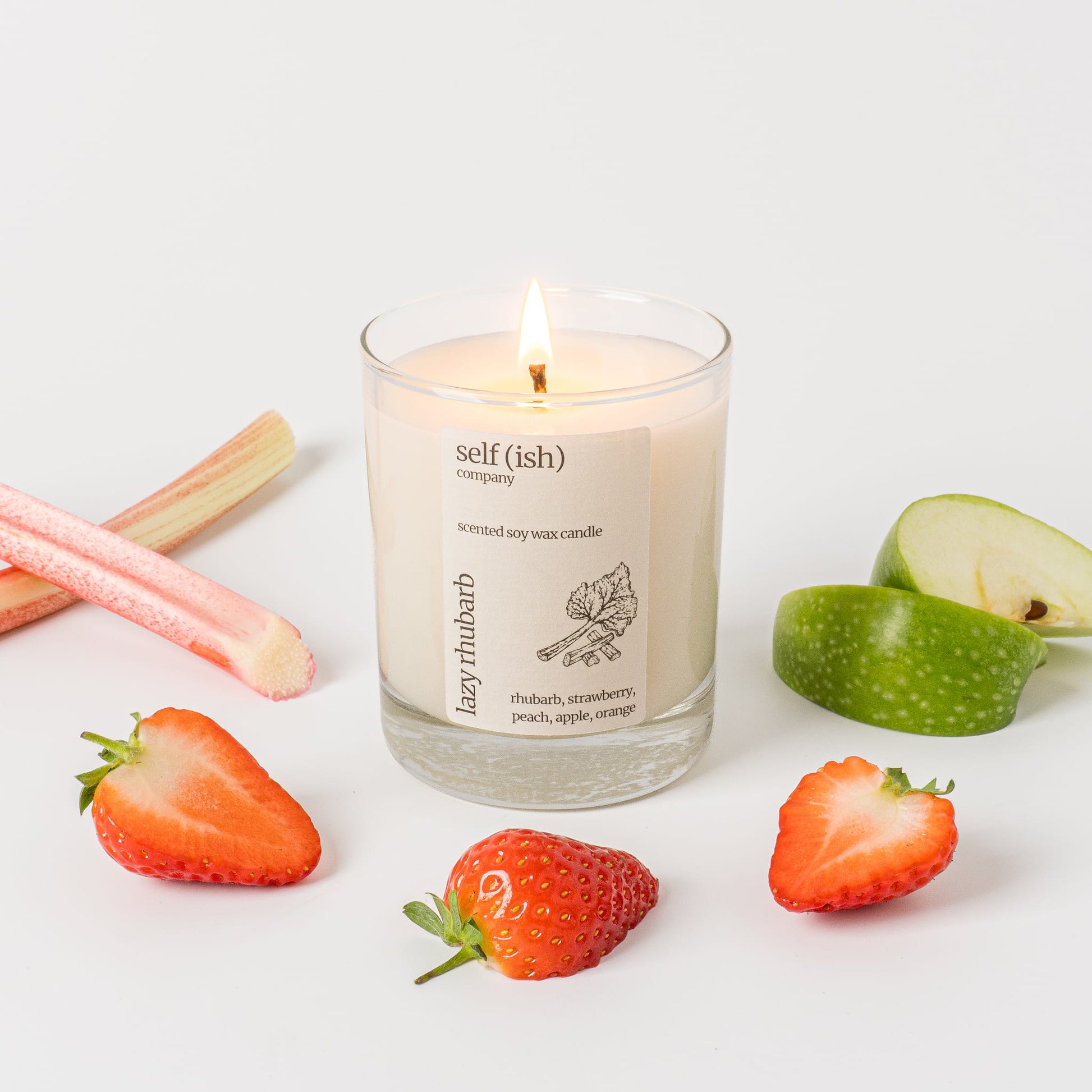 rhubarb scented soy wax candle with a burning single wick and pretty label, eco-friendly candle for sale suitable for vegans, best candle to buy online in the UK, handcrafted candle