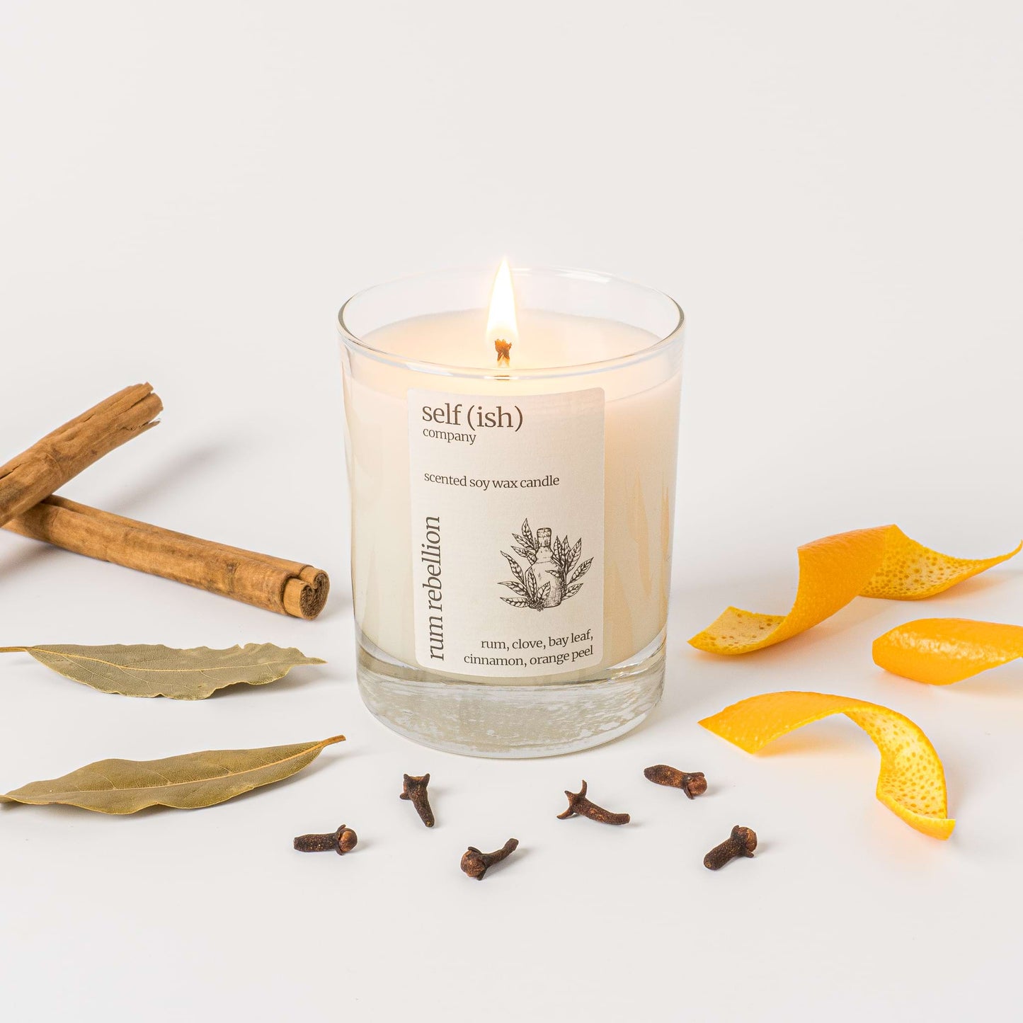 rum scented soy wax candle with a burning single wick and pretty label, eco-friendly candle for sale suitable for vegans, best candle to buy online in the UK, handcrafted candle