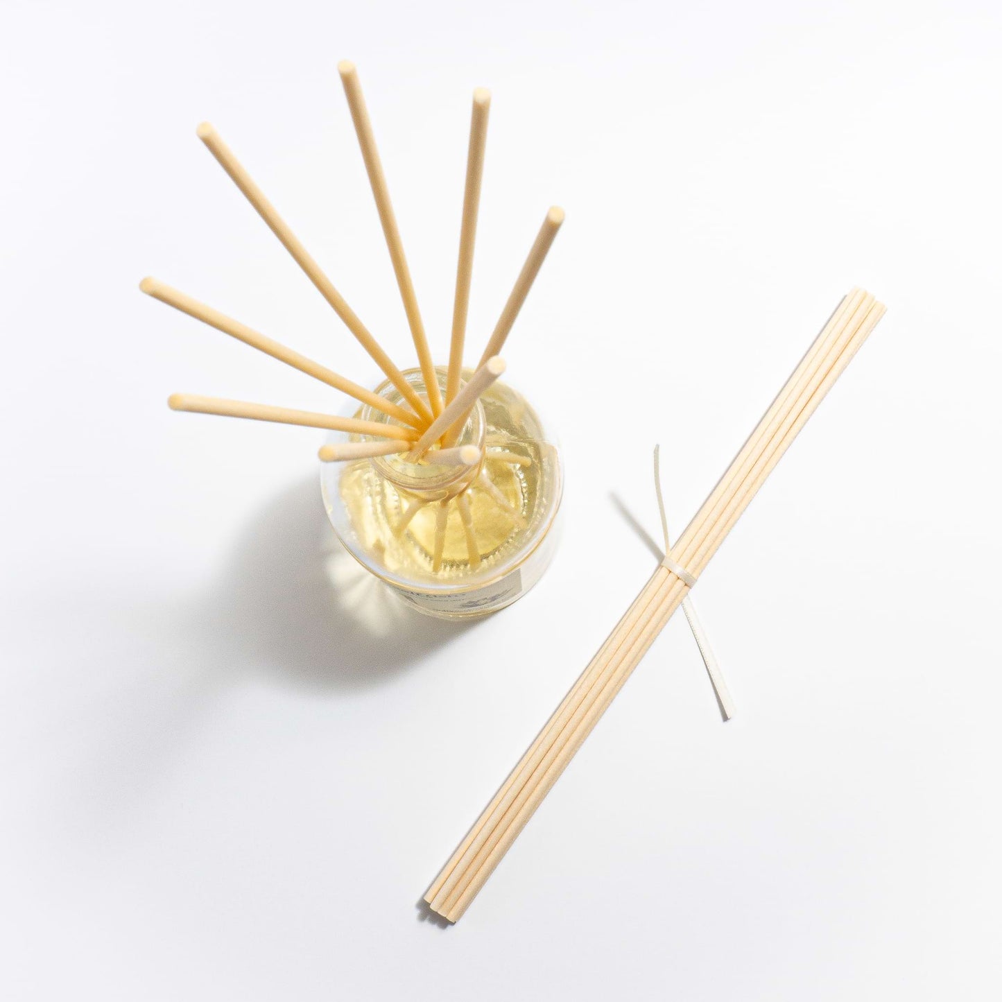 aerial view of scented reed diffuser with natural fibre reed sticks