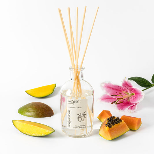 200ml scented mango reed diffuser in a stylish clear glass bottle and a wooden cork bamnboo lid